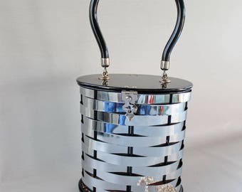 Dorset Rex Fifth Avenue Handbag. 1950s Basketweave Silver Tone Metal Bucket Style with Black Lucite Handle, Lid and Base.