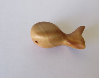 whale pendant made of wood