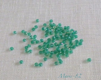 Faceted glass beads - 3 X 2 mm emerald green 90
