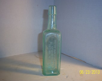 1890's Potter Drug & Chemical Boston, Ma Cuticura Treatment for Skin 7 1/2 inch Aqua medicine bottle