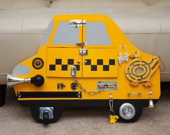 Busy Board Taxi Cab. Activity board, early development Montessori educational toy.