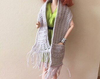 A scarf with a matching beret for barbie dolls