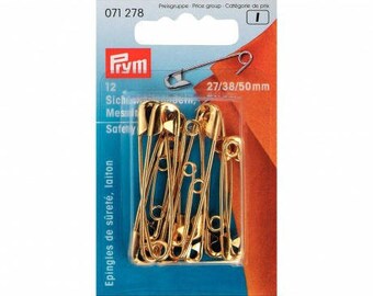 Assorted gold safety pins