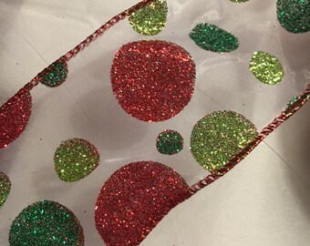 Sheer ribbon with red green and lime polka dots 2.5 inches wide, each roll is 25 ft. long