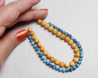 Two strands of Mother of Pearl shell beads