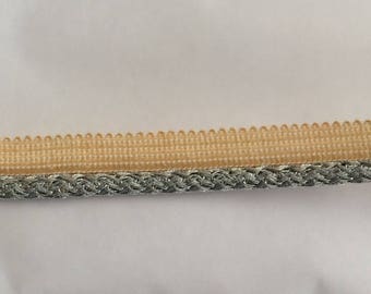 A silver grey piping trim sewing