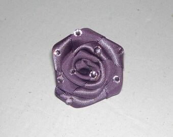Purple fabric flower and rhinestone ring