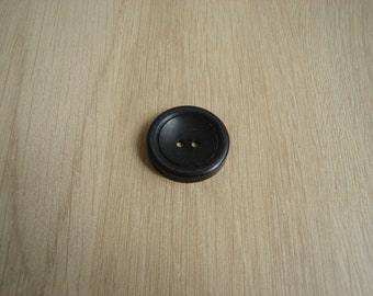 Black hollow round shape button