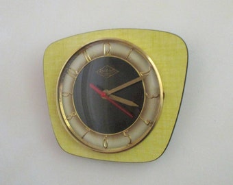 French 1950-60s Atomic Age LUTETIA - Yellow and Black Formica Wall Clock - Freeform Shape - Good Working Condition