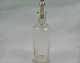 Vintage medical bottle with Bottle stopper , Antique glass bottle , medical or laboratory bottle . Vintage medical glass bottle