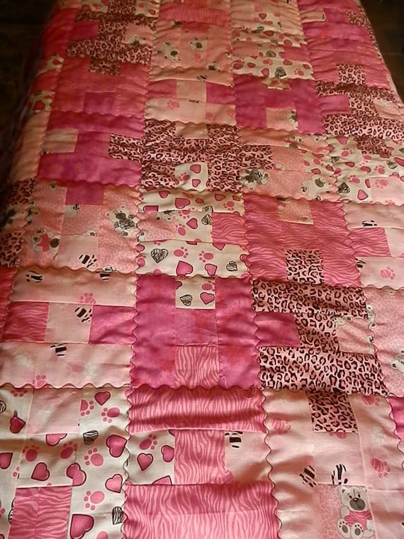 Award Winning Pink Animal Print Baby Quilt with free matching