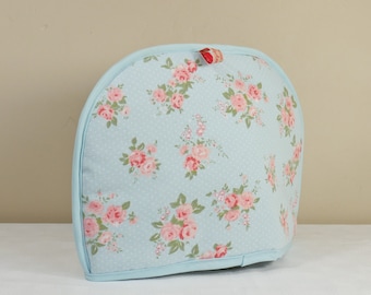 Tea cosy in sky blue with pink flower design