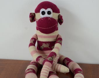 Maroon stripped monkey, sock monkey, maroon monkey