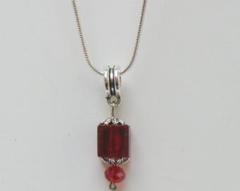 A pretty and delicate... from bright red pendant