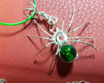 Spider pendant on corded necklace.
