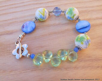 BRACELET, CERAMIC,SHELL, floral ceramic beads with tibetan silver beadcaps, glass beads. Gift.