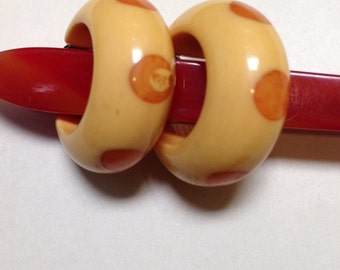 Bakelite polka dot earrings.