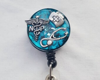 Nurse practitioner name badge holder with a teal background, nursing cap and stethoscope detail
