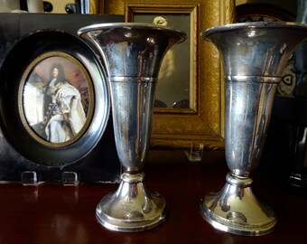 A pair of silver plated fluted vases