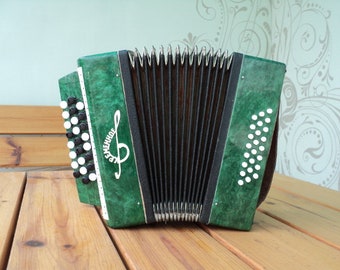 Vintage Soviet accordion for children. "Kremennoye" Bayan for beginners. Vintage musical instrument.