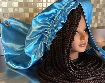 The shower cap with a grommet for box braids, dreadlocks, extensions, and long natural hair. Keep your hair wet free, and off your back!
