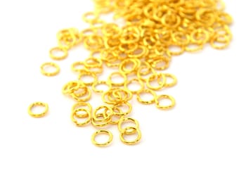 50 5mm gold plated metal jump rings