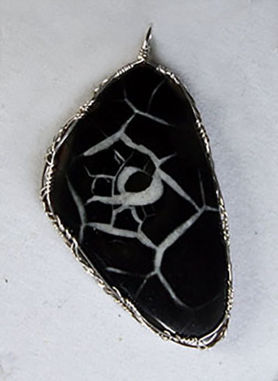 Septarian stone wrapped in a Celtic style with sterling silver