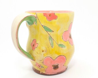 Yellow floral Earthenware mug. Wheel thrown, food safe mug made by Kaitlyn Brennan / Brennan pottery. This is a big mug perfect for coffee