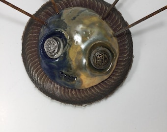 Bobby, ceramic and found object sculpture, mask, wall art