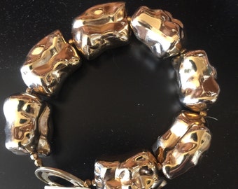 Gold tone plating over resin beads - very light weight with toggle clasp
