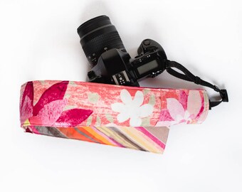 DSLR camera strap cover with lens cap pocket. fiesta floral with stripes.
