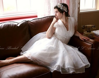 Vintage Style Alice in the Garden Tea Length A-Line Wedding Dress featuring Cap Sleeves and Bow.