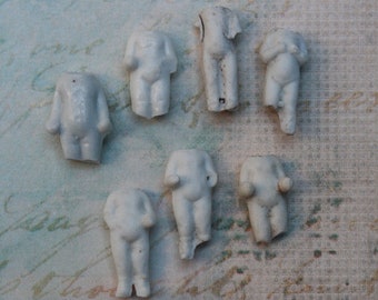 7 Tiny Torso Dolls Frozen Charlotte Antique 1 inch high for jewelry or collage art