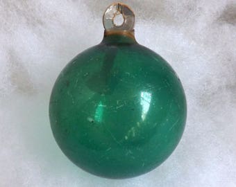 Vintage Christmas ornament unsilvered WWII paper cap glass ball green