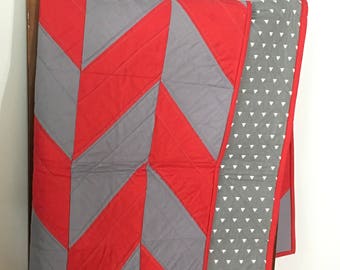 Red and grey herringbone quilt