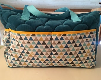 New diaper velvet bag is quilted and graphic fabric.