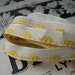 Vintage white woven jacquard ribbon trim with embroidered yellow elephants