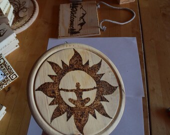 Painting pyrography burning on wood meditation sun Meditation Man