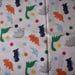 REMNANT-1/2 yard cotton fabric- dinosaurs