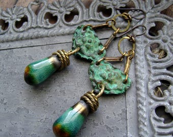 rustic artisan earrings with textured metal shields and artisan ceramics, verdigris patina, ooak, artifact style, bohemian, AnvilArtifacts