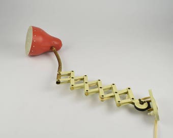 Scissors wall light. red scissors wall lamp from the 60s from Dutch company hala