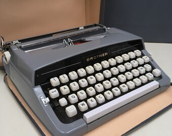 Vintage Brother Typewriter. Rich Grey, black and gold details. Excellent conditition