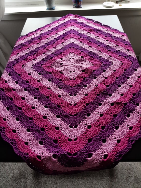 Hand crocheted virus blanket.