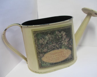 Vintage rustic decorative metal watering can used