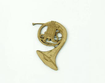 Decorative musical instrument of the brass family: the French Horn