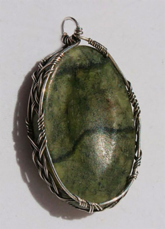 Kilkenny marble pendant wrapped Celtic style in silver
