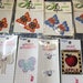 8 Vintage appliques - still in original packaging - 9 Butterflies 1 Apple 3 Bows with Roses - from JHB and Wrights like new and ready to go