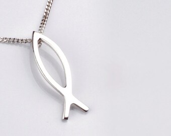 Sterling silver fish pendant.