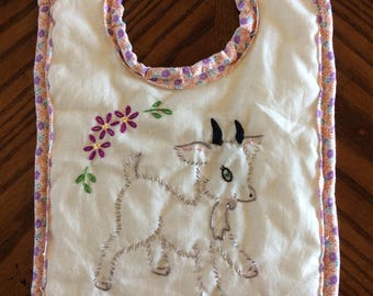 Hand Embroidered baby bib w/ goat on it