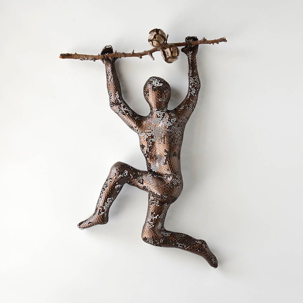 Metal wall art Climbing man sculpture on tree branch